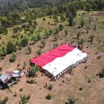 Satgas Madago Raya dan Eks Napiter Bentangkan Bendera Merah Putih Raksasa di Gunung Biru Poso