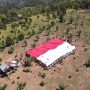 Satgas Madago Raya dan Eks Napiter Bentangkan Bendera Merah Putih Raksasa di Gunung Biru Poso